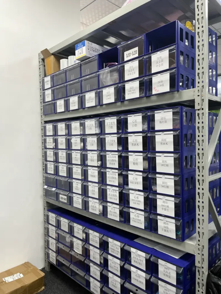 Jinnuo jewelry factory warehouse with organized product trays and order storage