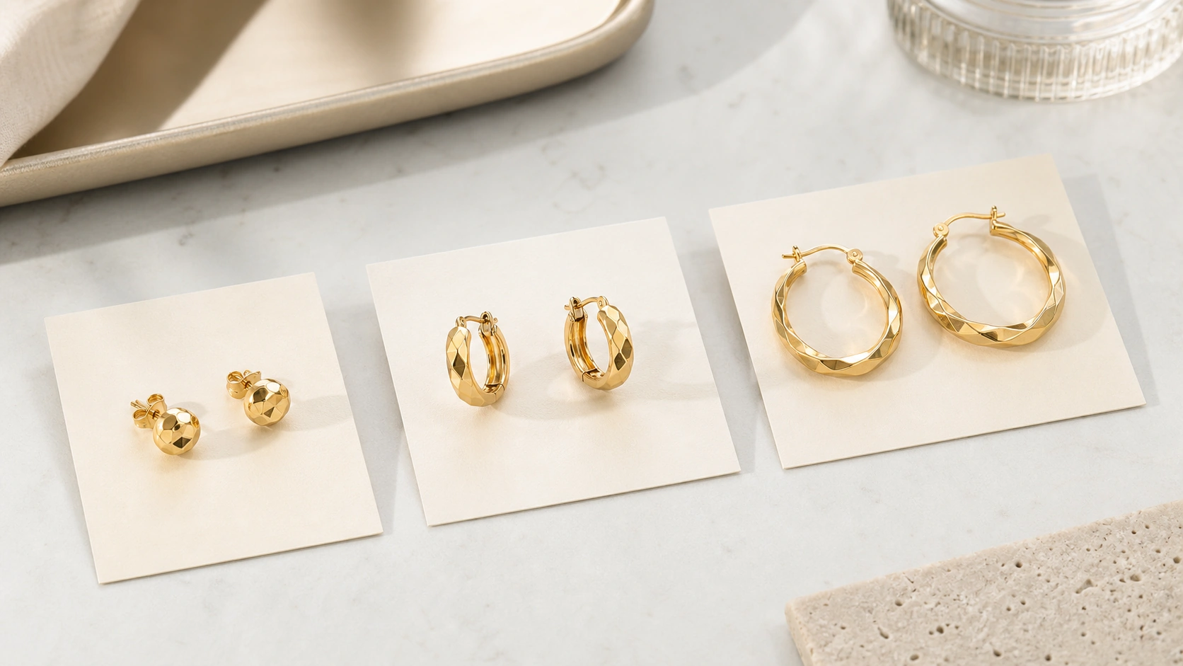 Stud and hoop earring pairs arranged for brand assortment planning